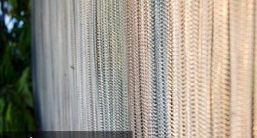 How can wire mesh curtains be utilised in architecture and interior design?